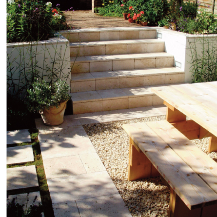 Travertine steps and rendered wall